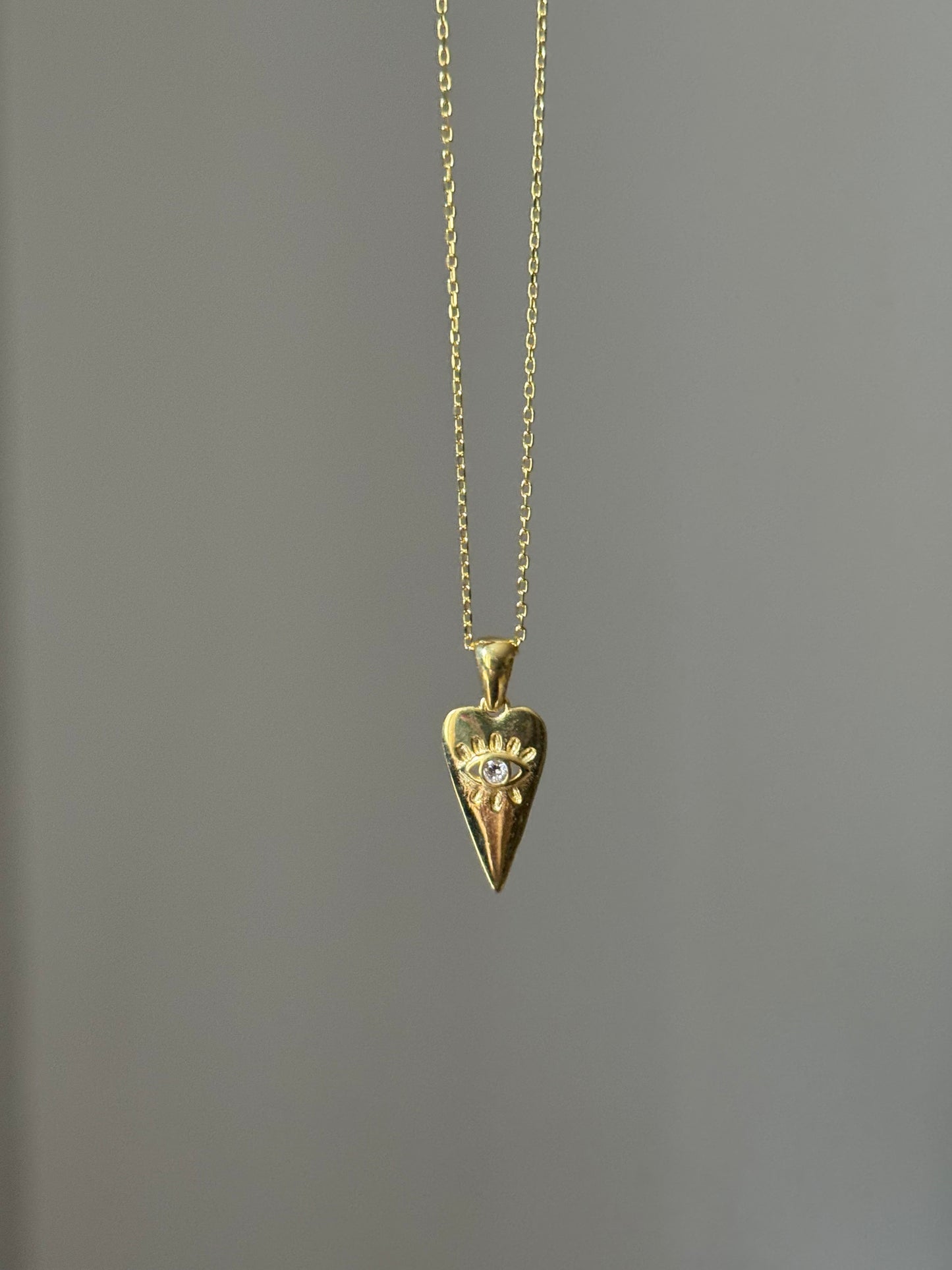 Triangle heart evil eye necklace
