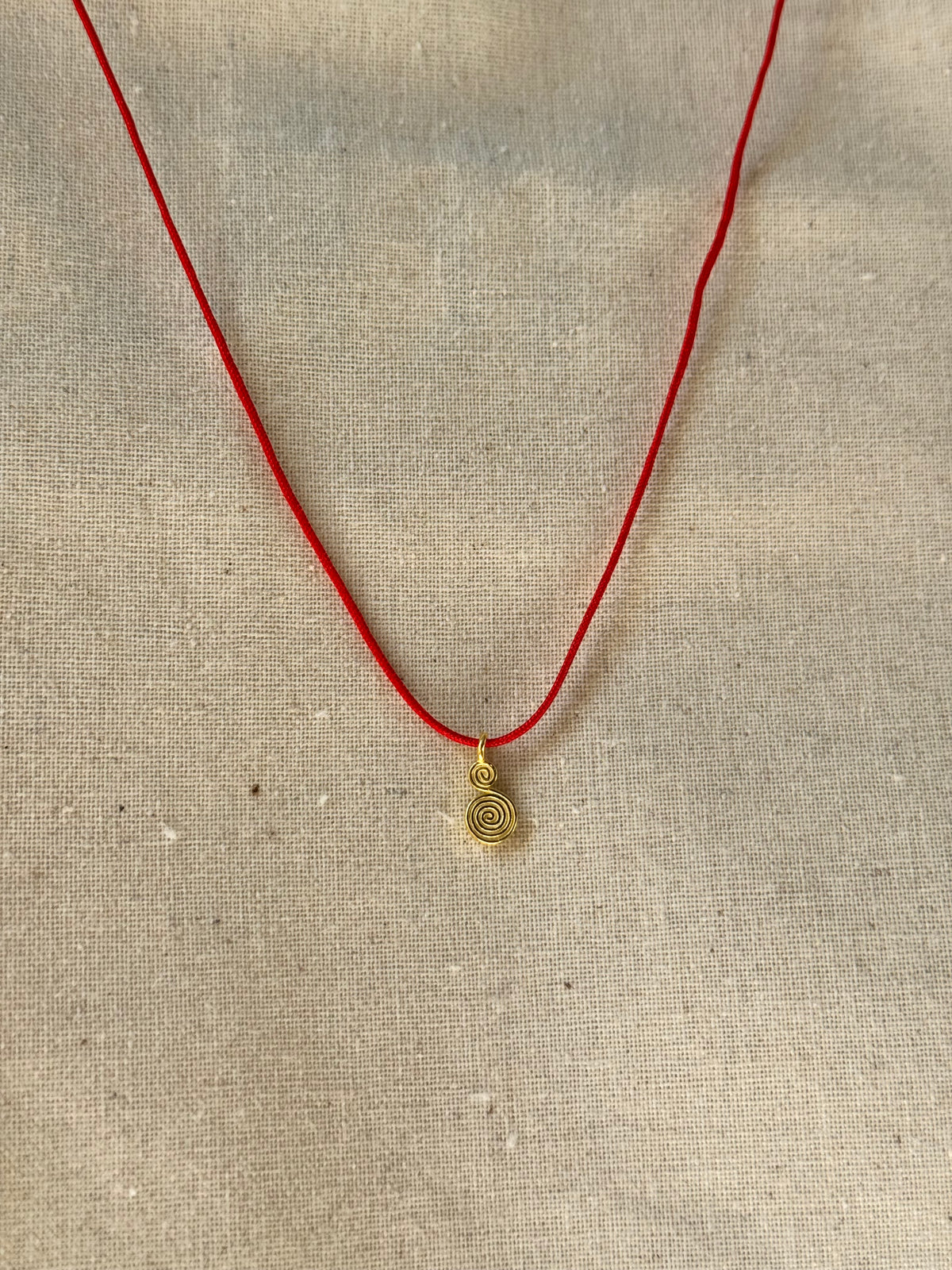 Spiral red cord necklace