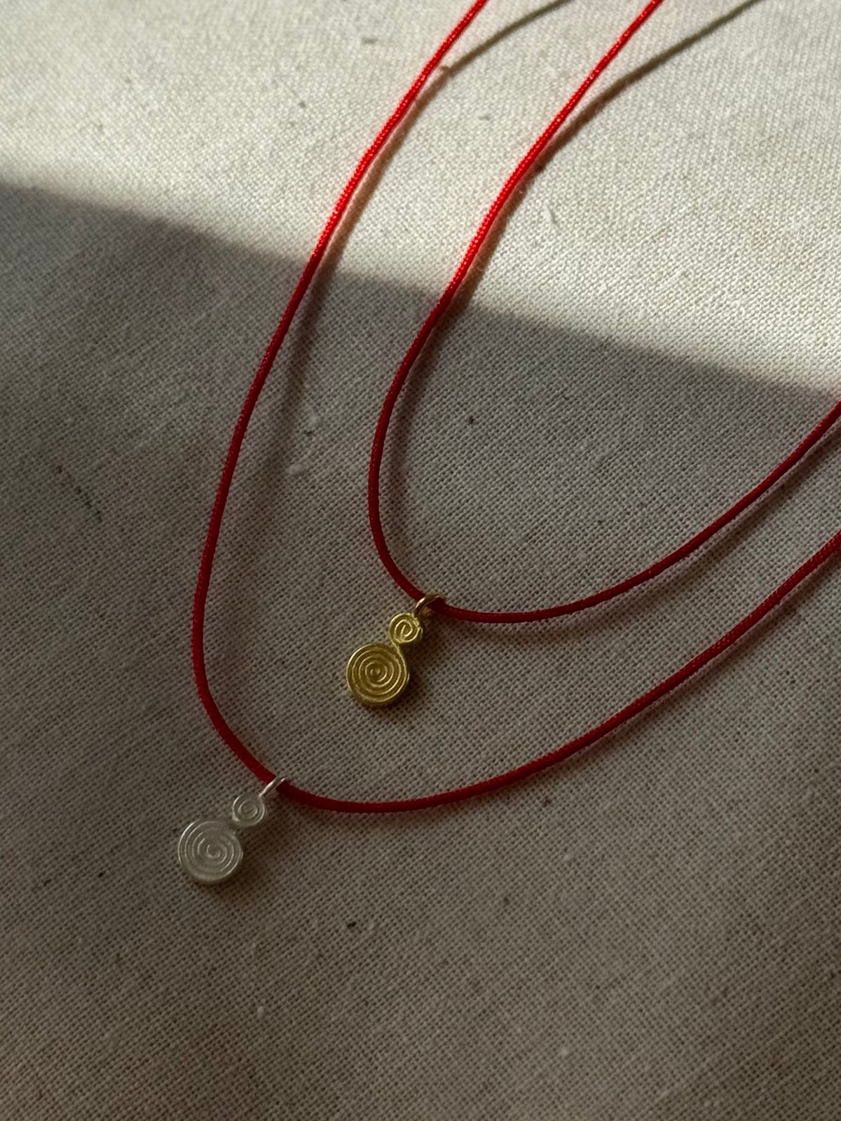 Spiral red cord necklace