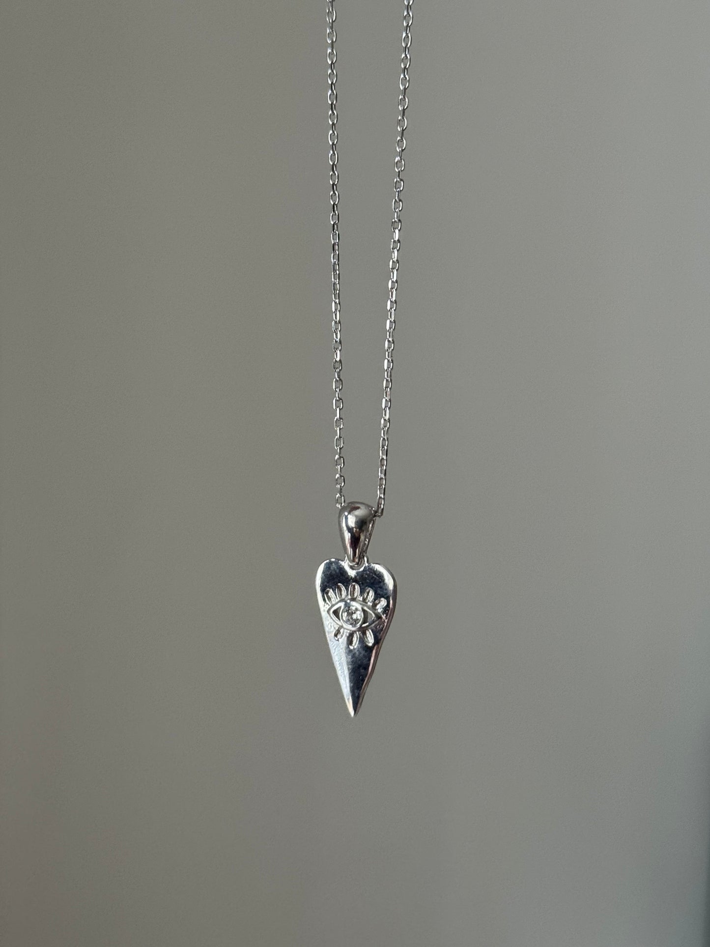 Triangle heart evil eye necklace