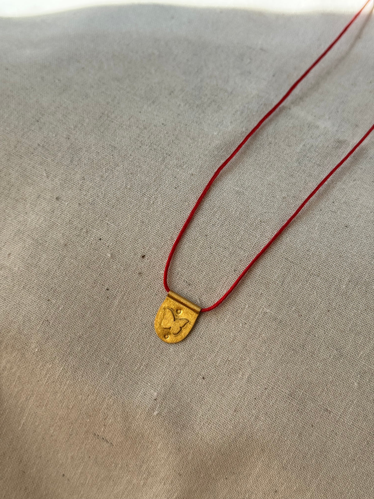 Papillon red cord necklace