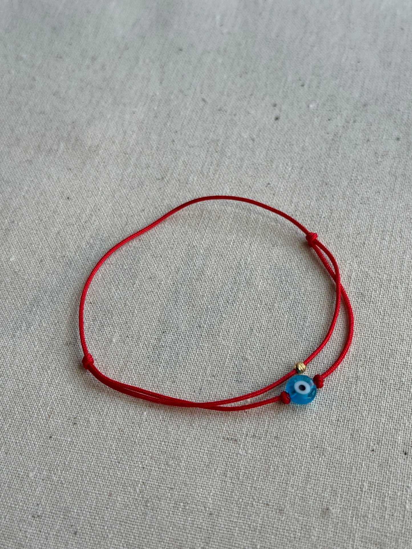 Dual cord evil eye bracelet