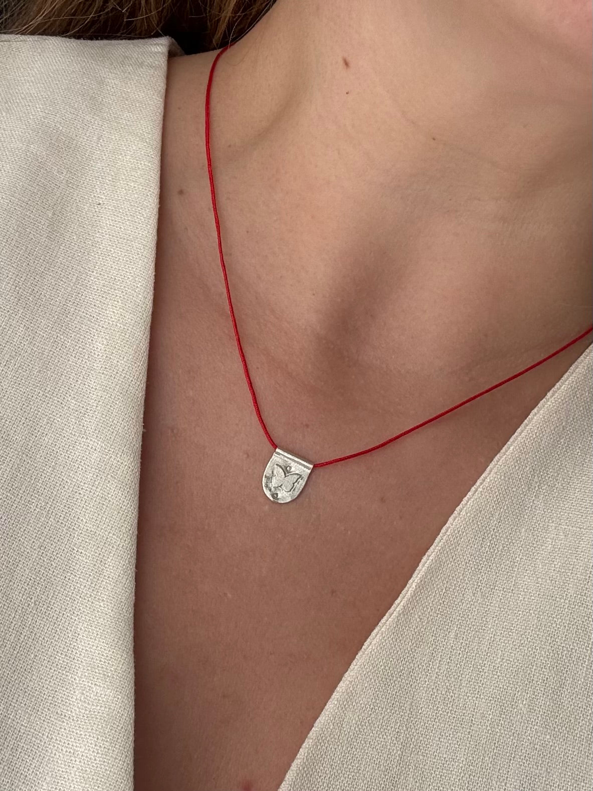 Papillon red cord necklace