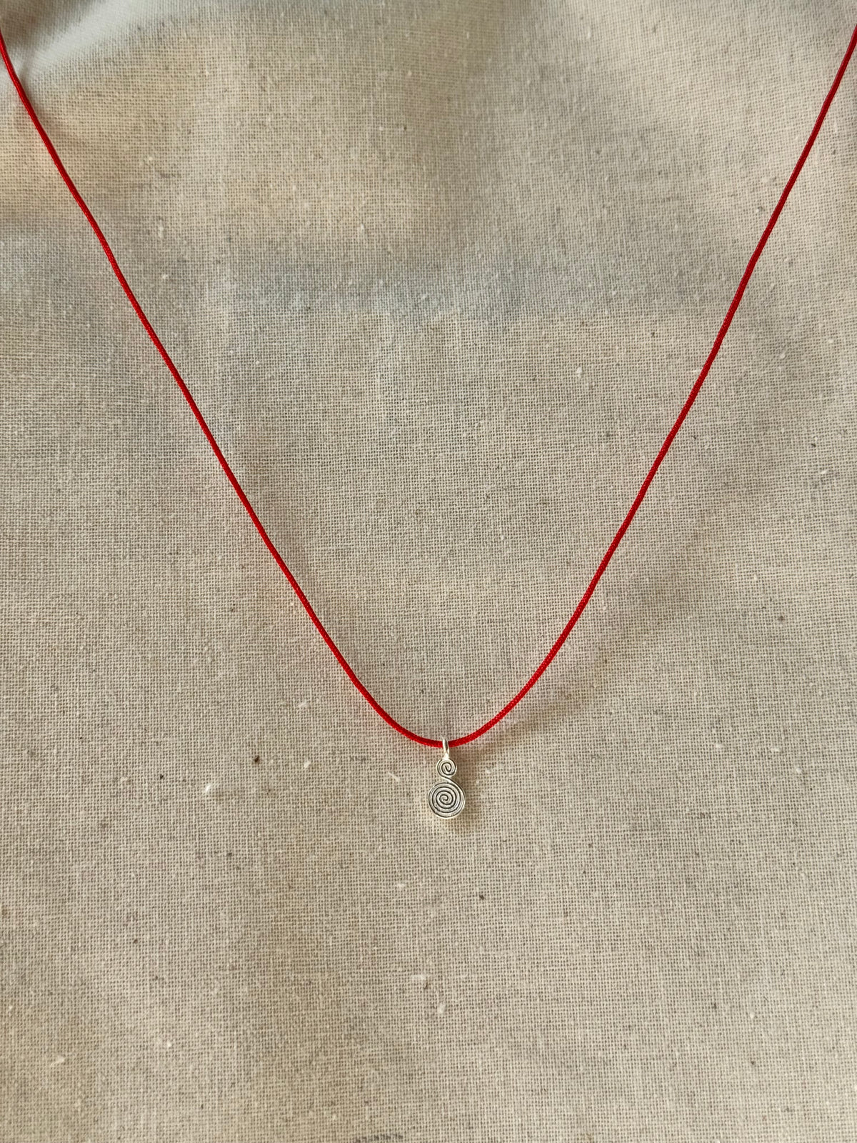 Spiral red cord necklace