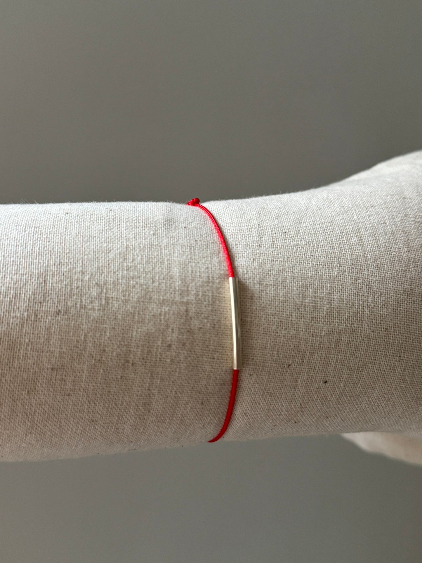 Red string tube bracelet