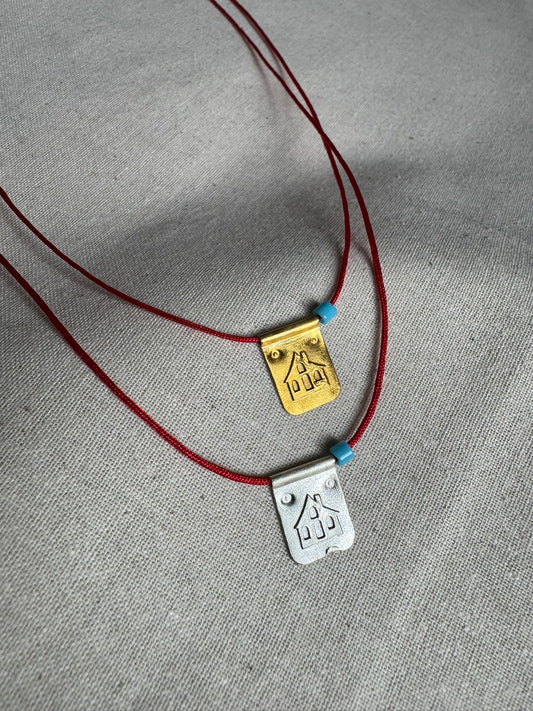 Red string house necklace