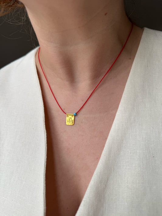 Red string house necklace
