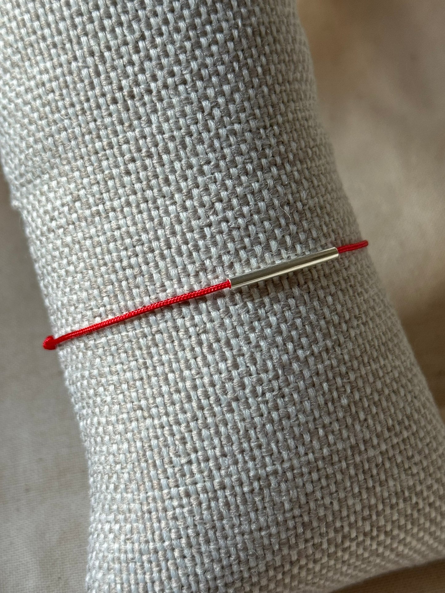 Red string tube bracelet